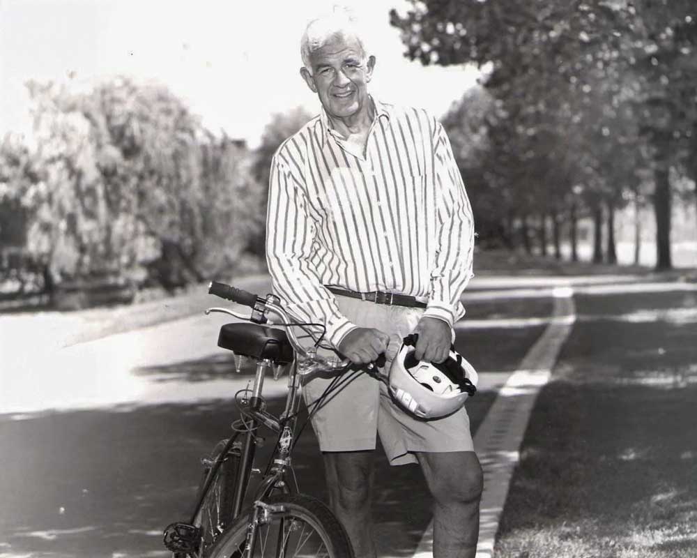 Historical photo of a man biking